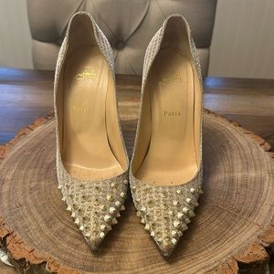 Louboutin gold fabric heels with silvery studs on toe.